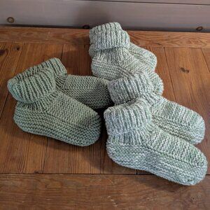 Three pairs of hand knitted slippers